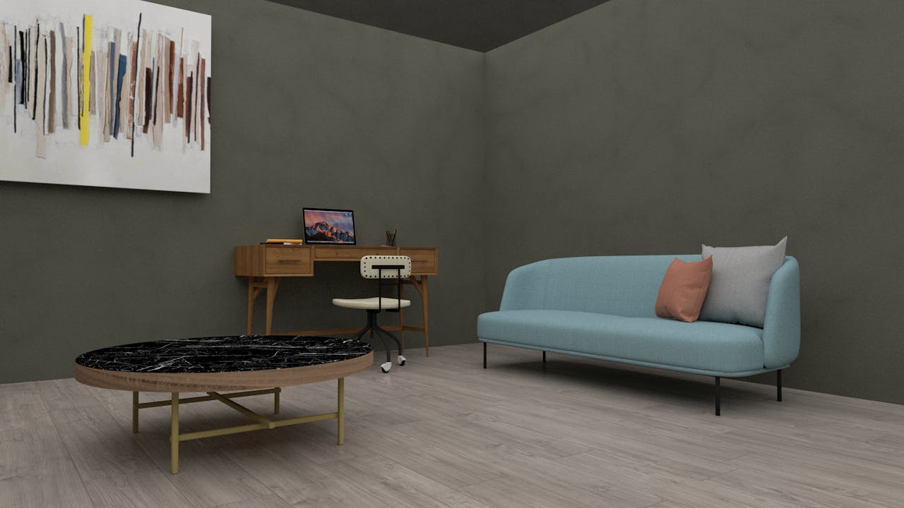 Stylish living room with a modern sofa, desk, and abstract art for a minimalist touch.